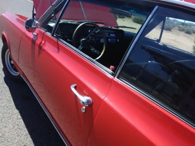 1964 Red Oldsmobile Cutlass Coupe