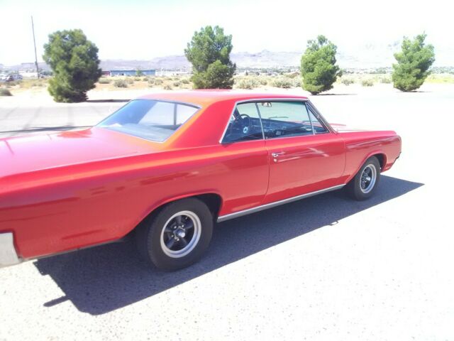1964 Red Oldsmobile Cutlass Coupe