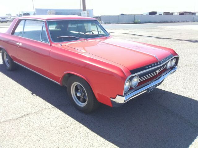 1964 Red Oldsmobile Cutlass Coupe