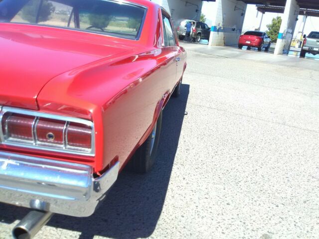 1964 Red Oldsmobile Cutlass Coupe