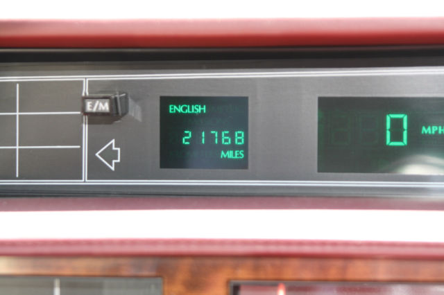 1990 White Cadillac DeVille Sedan