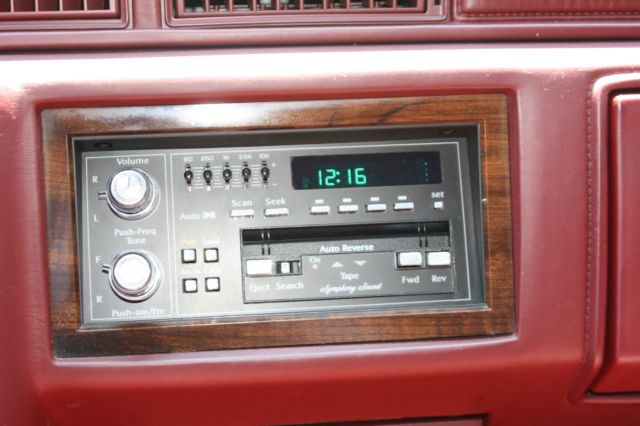 1990 White Cadillac DeVille Sedan