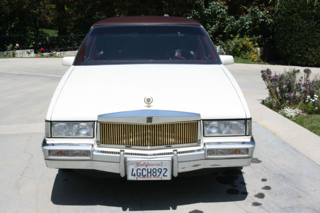 1990 White Cadillac DeVille Sedan