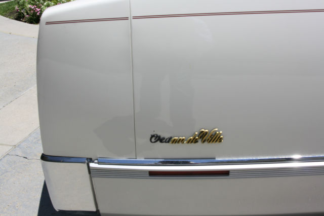 1990 White Cadillac DeVille Sedan