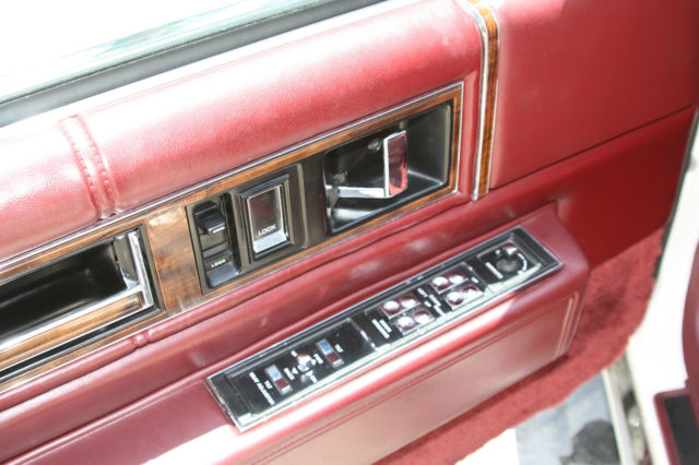 1990 White Cadillac DeVille Sedan