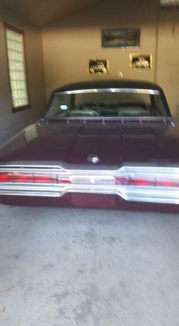 1966 Burgundy Ford Thunderbird 2dr full black vinyl top with tan/cream interior