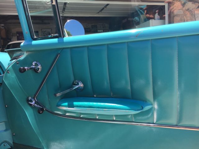 1957 turquoise and India Ivory Chevrolet Bel Air/150/210 sedan