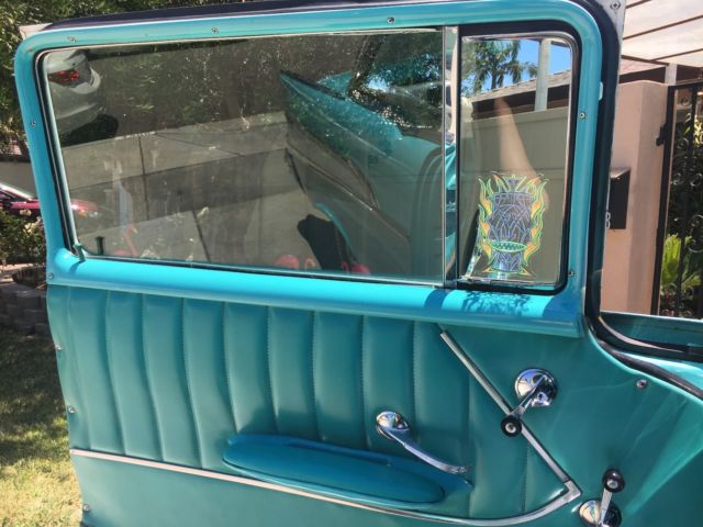 1957 turquoise and India Ivory Chevrolet Bel Air/150/210 sedan