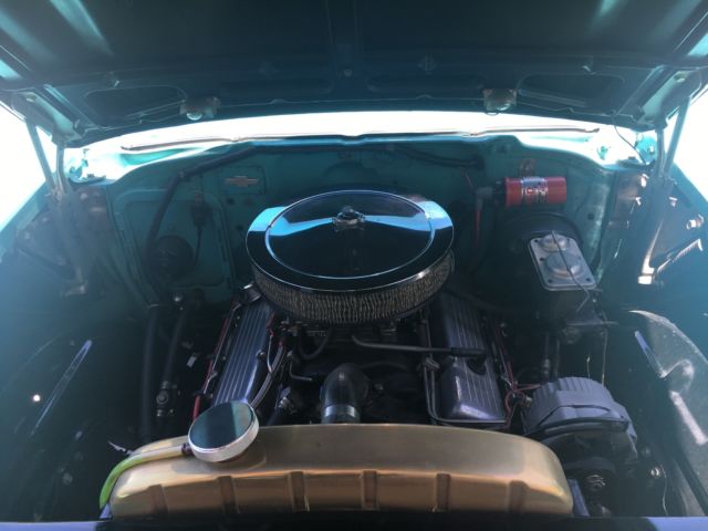 1957 turquoise and India Ivory Chevrolet Bel Air/150/210 sedan