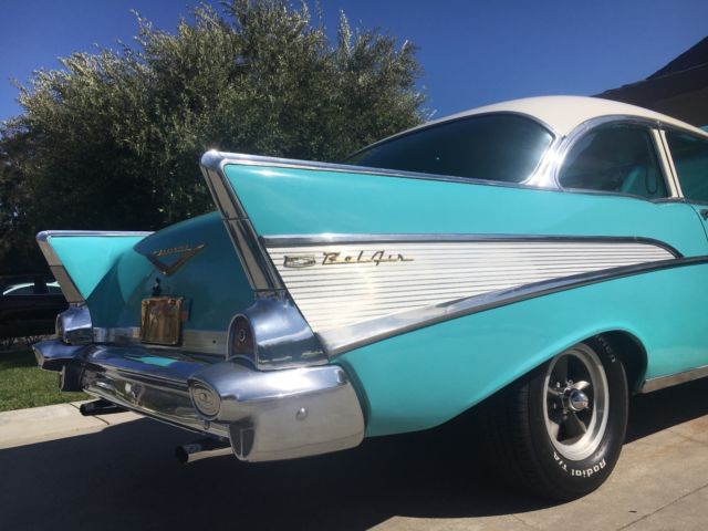 1957 turquoise and India Ivory Chevrolet Bel Air/150/210 sedan