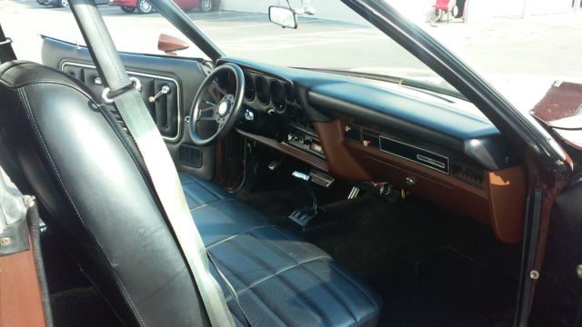 1976 brown Ford Torino Coupe