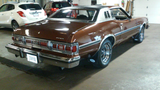 1976 brown Ford Torino Coupe