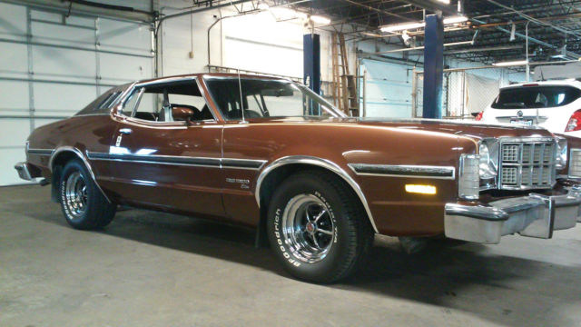 1976 brown Ford Torino Coupe
