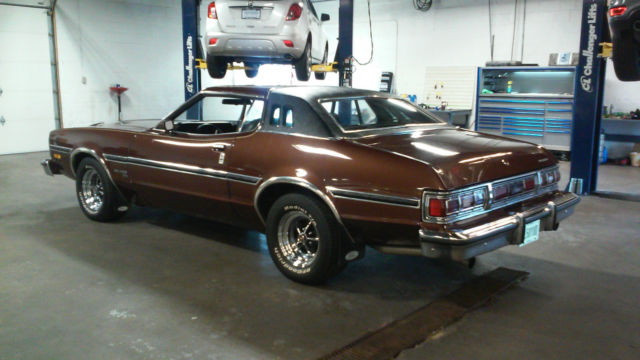 1976 brown Ford Torino Coupe