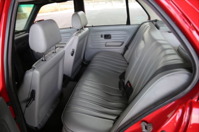 1990 red BMW 3-Series Sedan