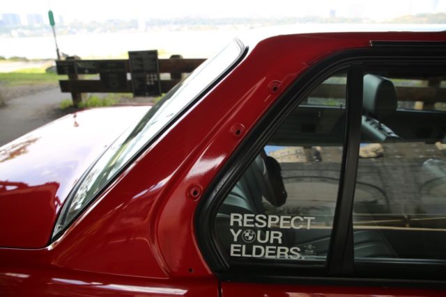 1990 red BMW 3-Series Sedan