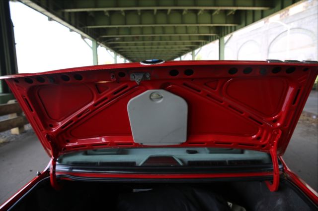 1990 red BMW 3-Series Sedan