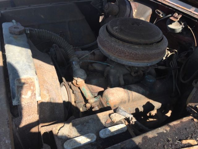 1955 rust Buick 4 door pillarless 4 door 