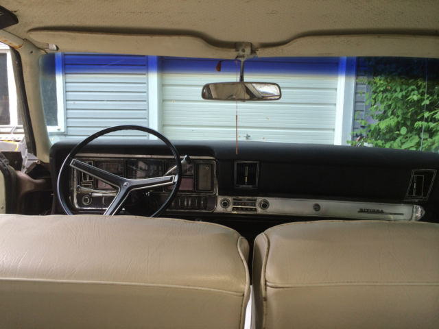 1990 Red Buick Riviera Coupe