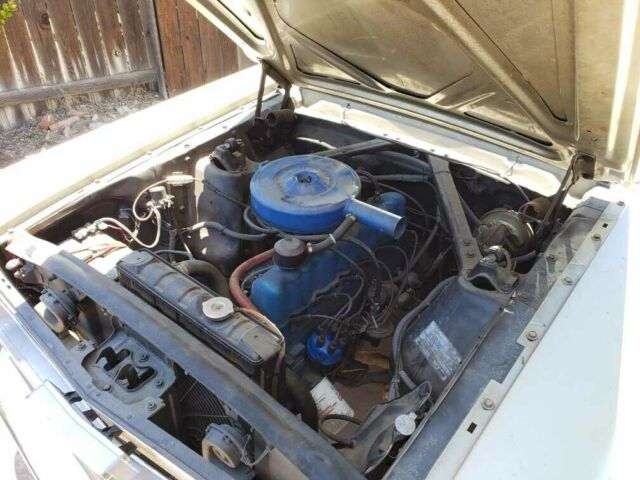 1966 beige Ford Mustang Coupe