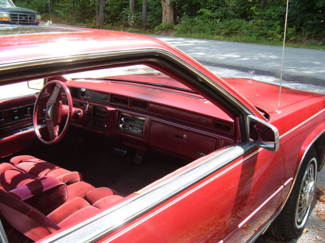 1988 Red Cadillac DeVille Coupe