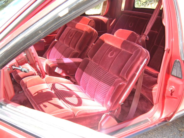 1988 Red Cadillac DeVille Coupe