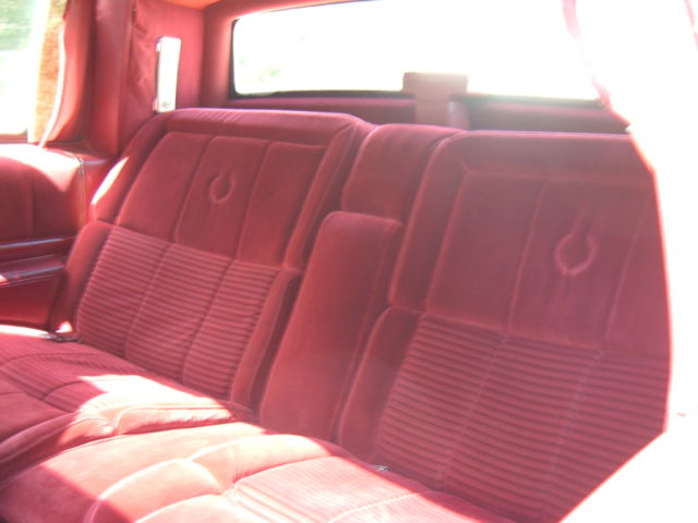 1988 Red Cadillac DeVille Coupe