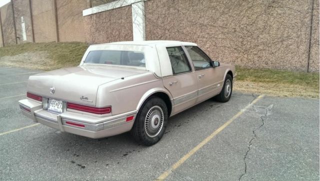 1991 Champagne Metallic Cadillac Seville Sedan