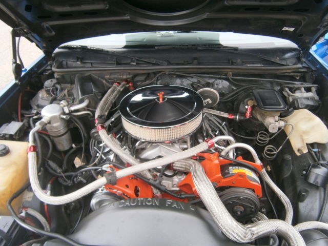 1980 blue and silver Chevrolet El Camino 2 door