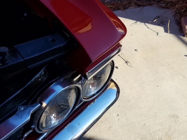 1966 red Chevrolet Chevelle Coupe