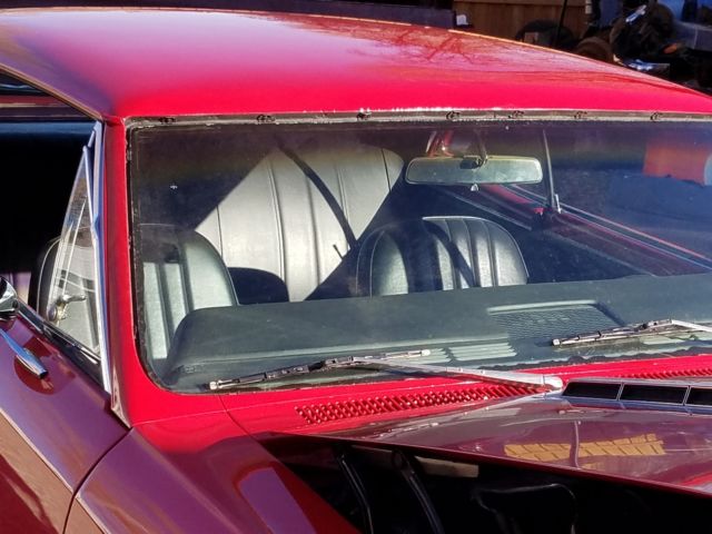 1966 red Chevrolet Chevelle Coupe