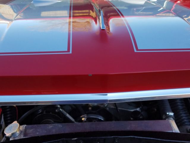 1966 red Chevrolet Chevelle Coupe