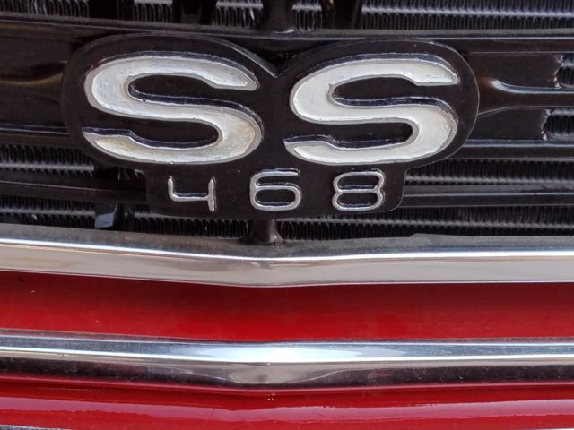 1966 red Chevrolet Chevelle Coupe