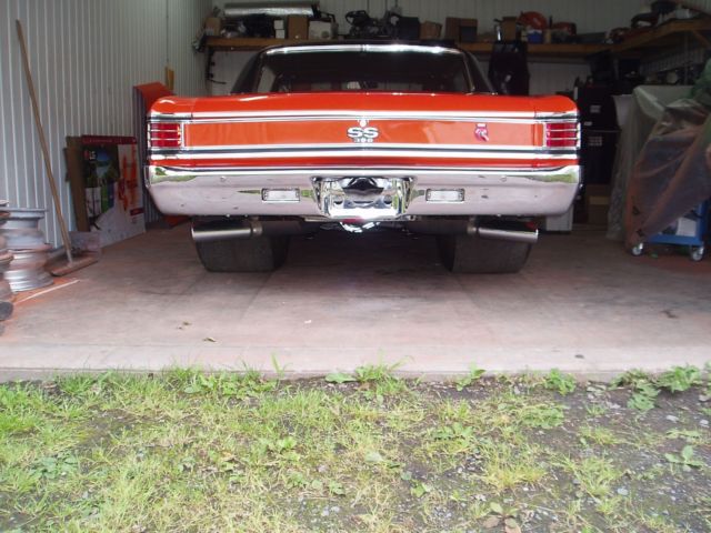 1967 orange Chevrolet Chevelle Coupe