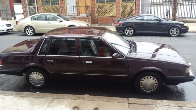 1987 purple/burgundy Chevrolet Sedan