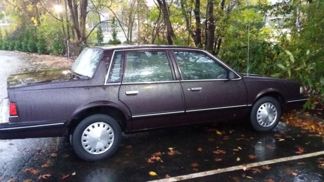 1987 purple/burgundy Chevrolet Sedan