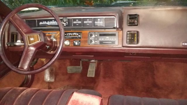 1987 purple/burgundy Chevrolet Sedan