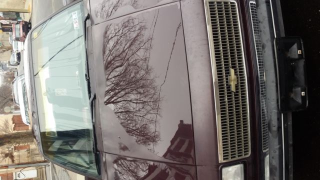1987 purple/burgundy Chevrolet Sedan