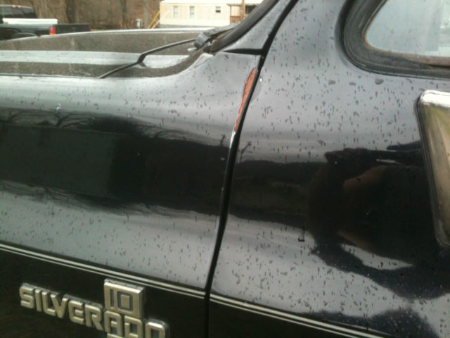 1987 Black and silver Chevrolet C-10 Standard Cab Pickup