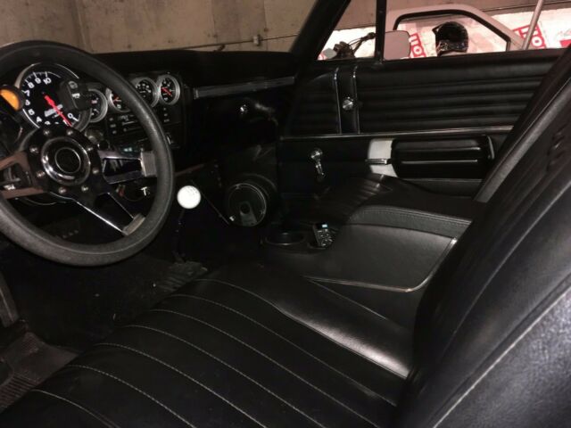 1968 black and burgundy with silver stripe Chevrolet Chevelle Coupe