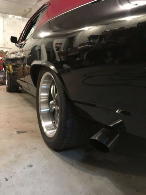 1968 black and burgundy with silver stripe Chevrolet Chevelle Coupe