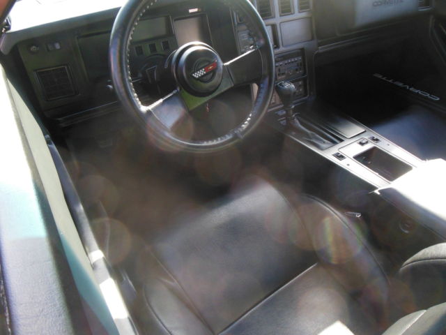 1986 maroon Chevrolet Corvette Coupe