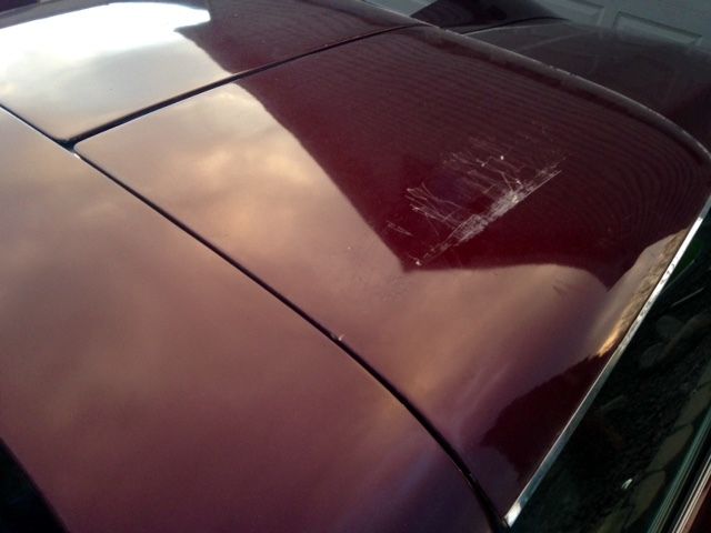 1973 maroon Chevrolet Corvette Coupe