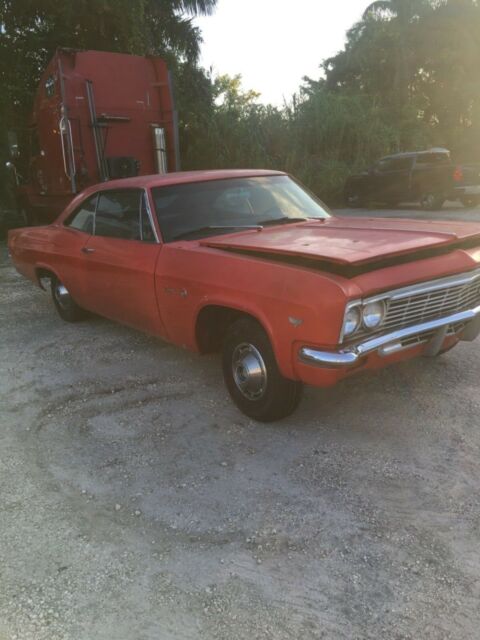 1966 white Chevrolet Impala Coupe