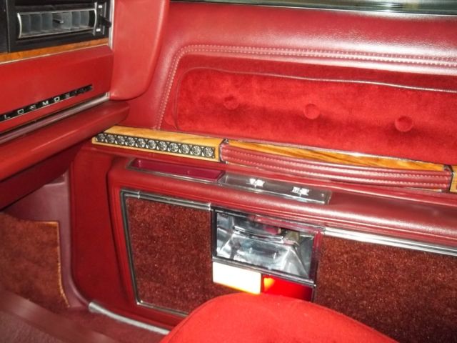 1976 Red Orange with Cream top Oldsmobile Ninety-Eight Sedan