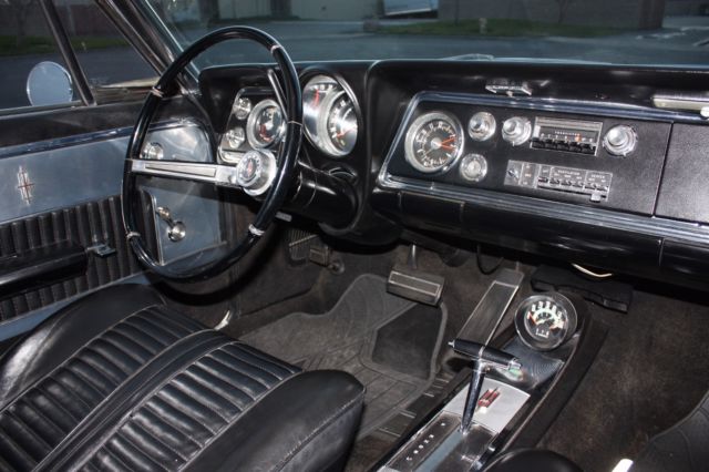 1965 White Oldsmobile Starfire Coupe