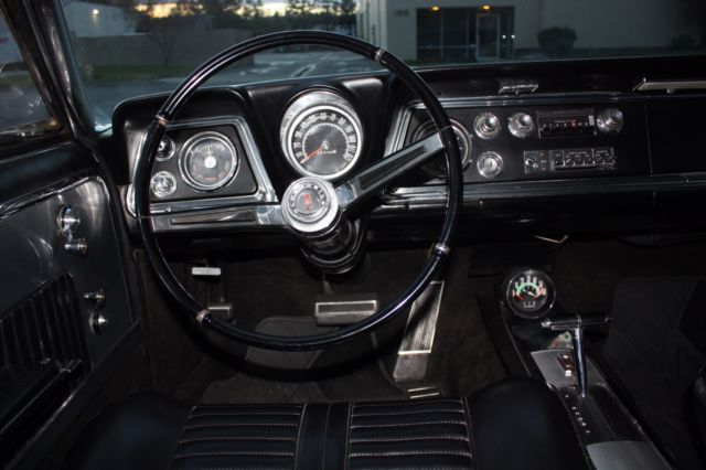 1965 White Oldsmobile Starfire Coupe