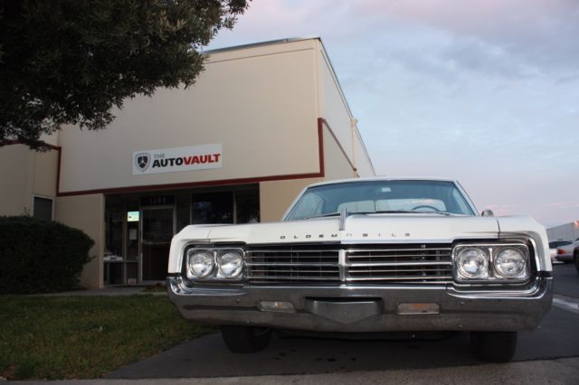 1965 White Oldsmobile Starfire Coupe