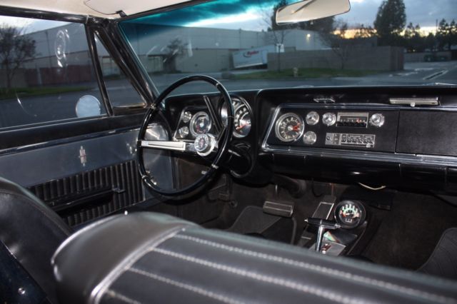 1965 White Oldsmobile Starfire Coupe