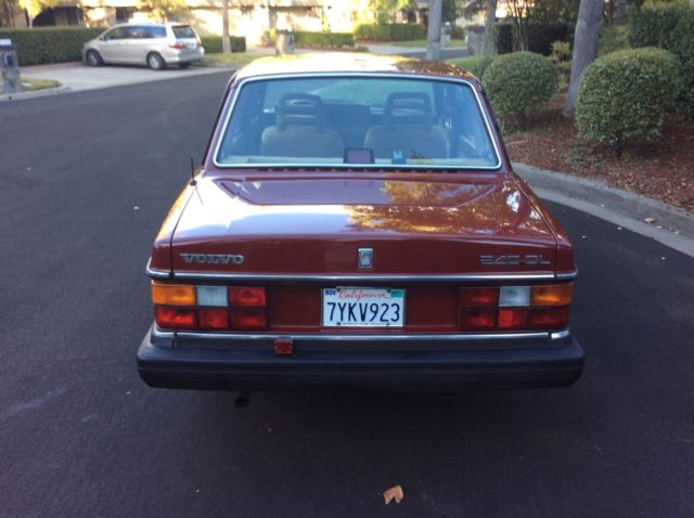 1986 Red Volvo 240 Sedan